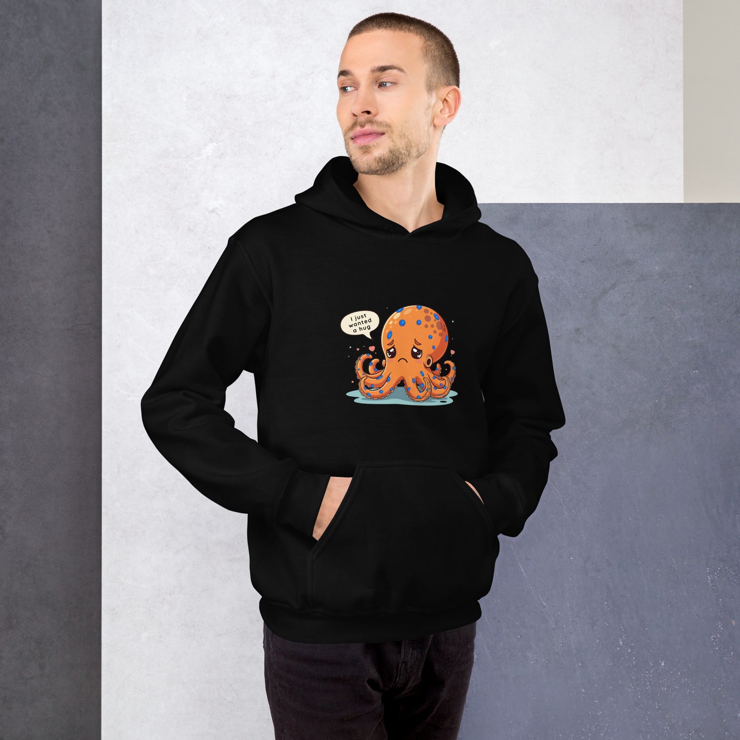 man wearing a black hoodie with a blue ringed octopus design in the front