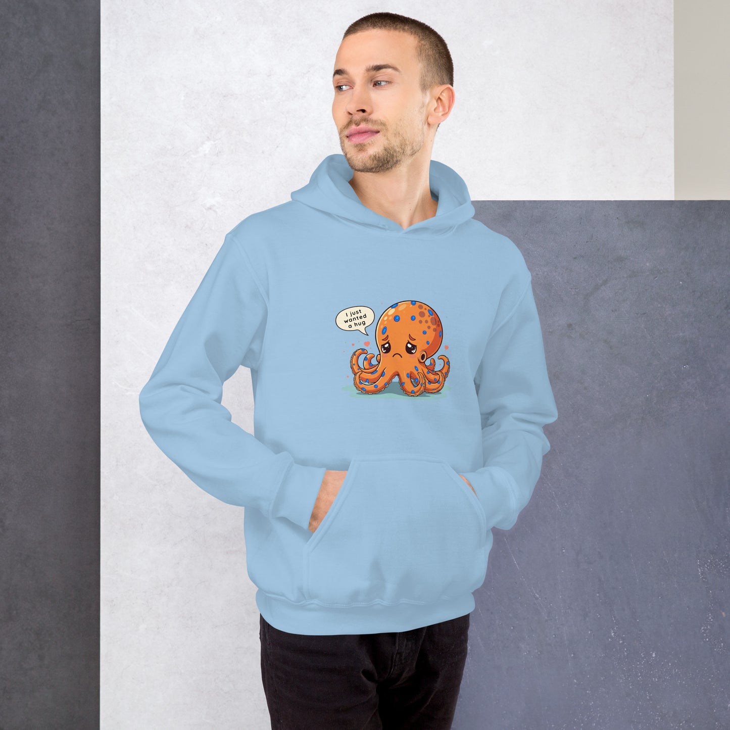 man wearing a blue hoodie with a blue ringed octopus design in the front