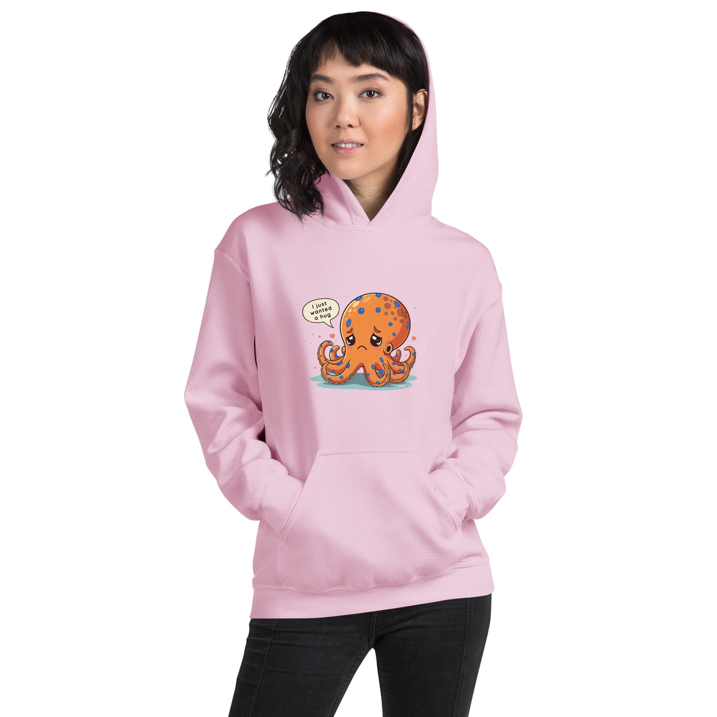 woman wearing a pink hoodie with a blue ringed octopus design in the front