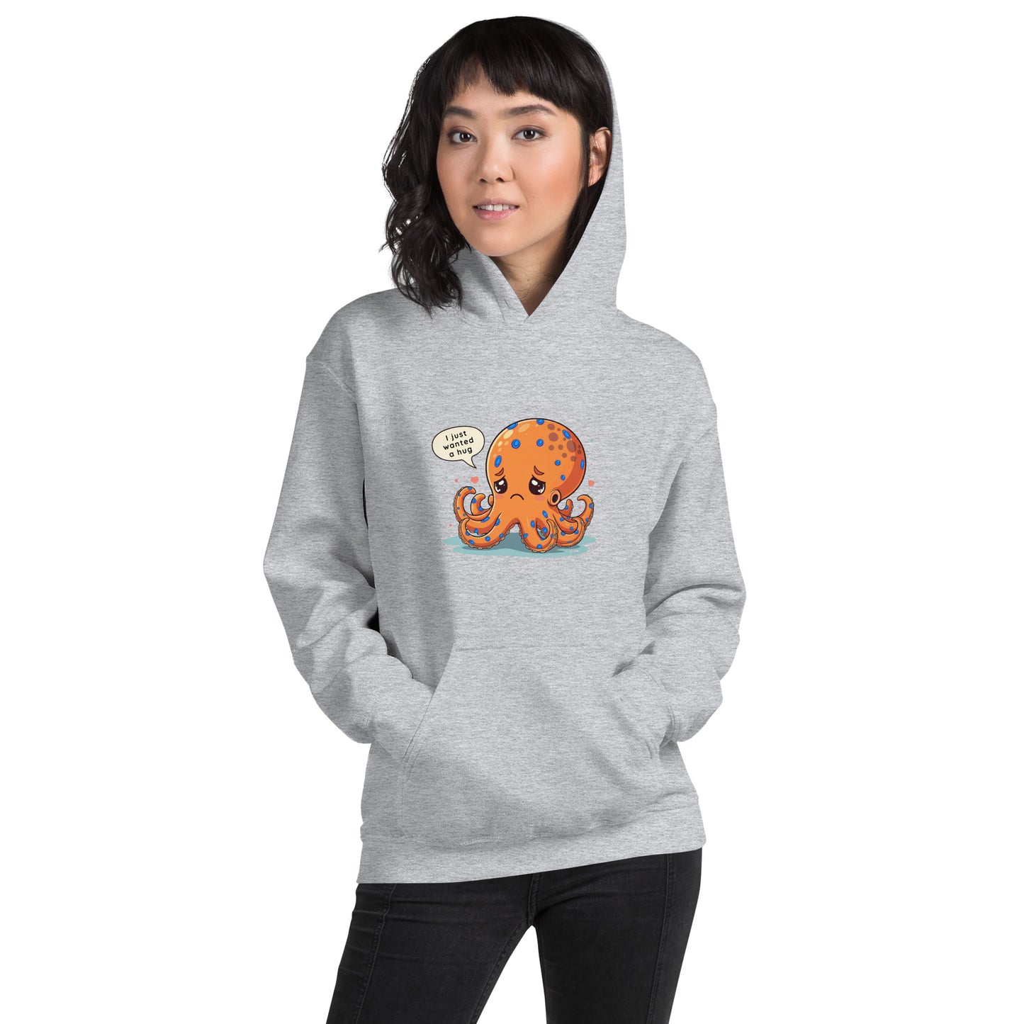 woman wearing a grey hoodie with a blue ringed octopus design in the front