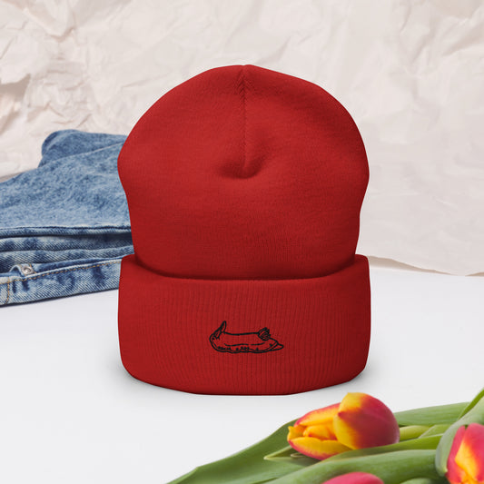 red beanie with a black nudibranch embroidery logo