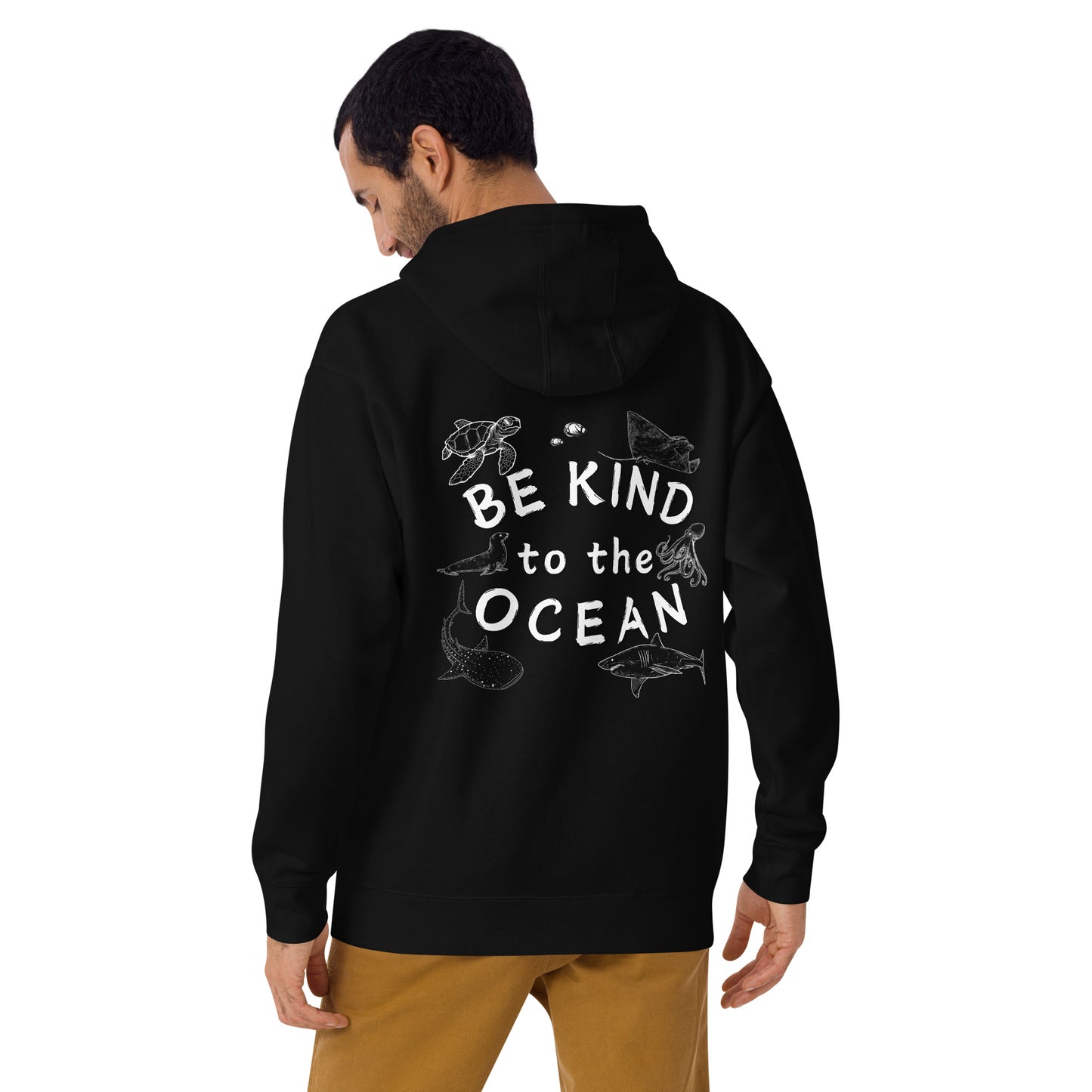 Man wearing a black hoodie with the logo written be kind to the ocean with marine animals around it