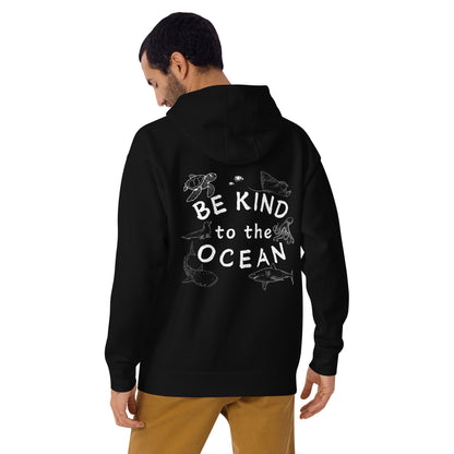 Man wearing a black hoodie with the logo written be kind to the ocean with marine animals around it