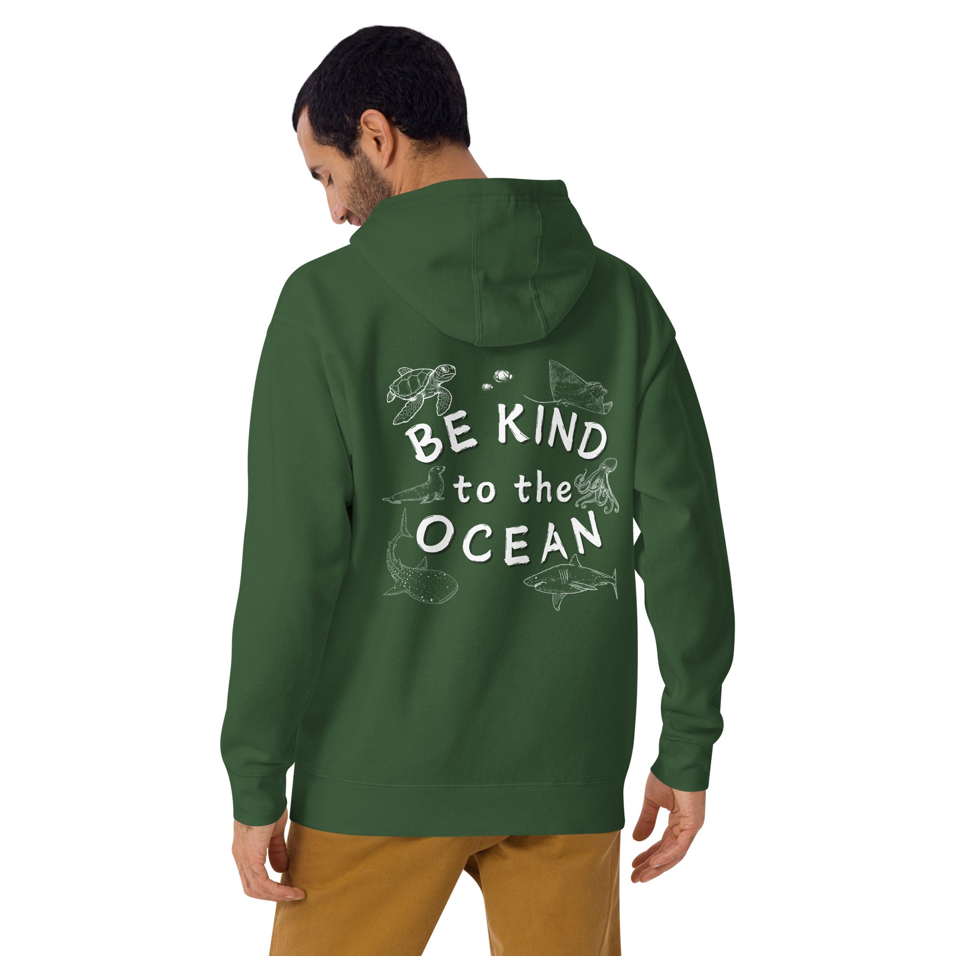 Man wearing a green hoodie with the logo written be kind to the ocean with marine animals around it