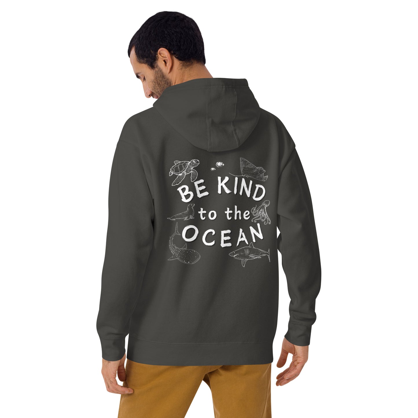 Man wearing a grey hoodie with the logo written be kind to the ocean with marine animals around it