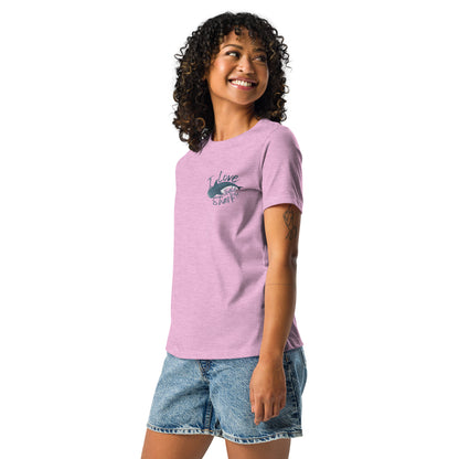 A woman wearing a lilac shirt with a logo of a whale shark and the words I love whale sharks on the front around it