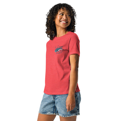 A woman wearing a red shirt with a logo of a whale shark and the words I love whale sharks on the front around it