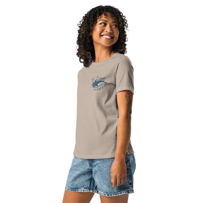 A woman wearing a beige shirt with a logo of a whale shark and the words I love whale sharks on the front around it